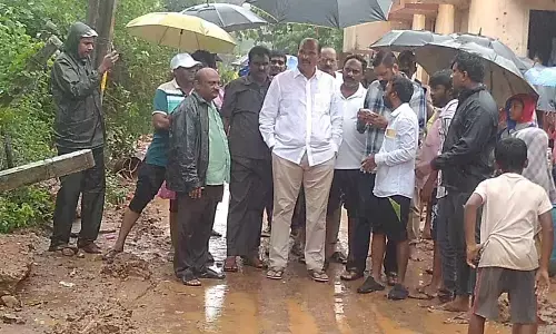 Minister Kolusu Parthasarathy visiting areas affected by heavy rains in Nuzvid on Sunday