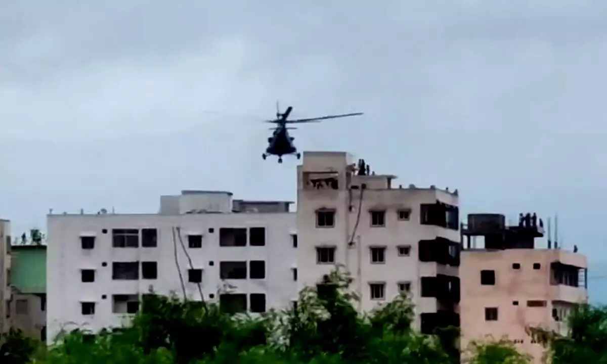 Food Parcels delivered to Flood Victims in Vijayawada with helicopters