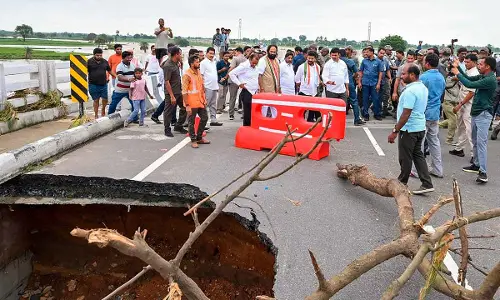 CM Revanth Reddy, Deputy CM Bhatti Vikramarka and Minister Ponguleti inspect a damaged road near Khammam on Monday