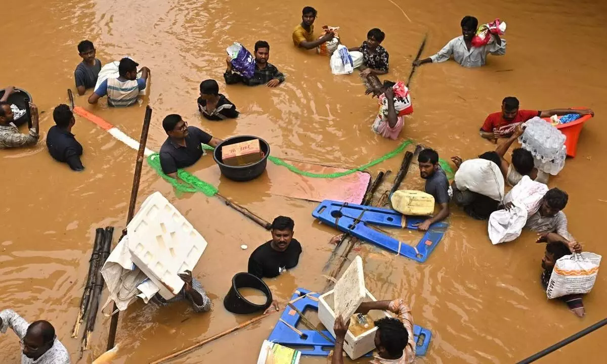 Relief Efforts Intensify in Flood-Hit Vijayawadas Singh Nagar, restores water supply