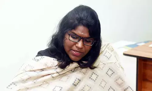 Collector K Vetri Selvi talking with officials on the measures to be taken in the wake of increasing Godavari level in Eluru on Tuesday