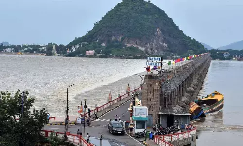 Irrigation officials are releasing surplus water from Prakasam barrage in Vijayawada on Tuesday    ( Hans photo Ch Venkata Mastan