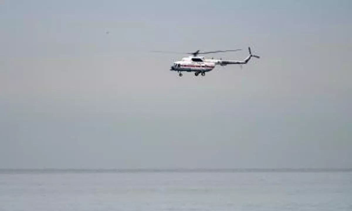 Coast Guard helicopter crashes in sea, search on for missing pilot