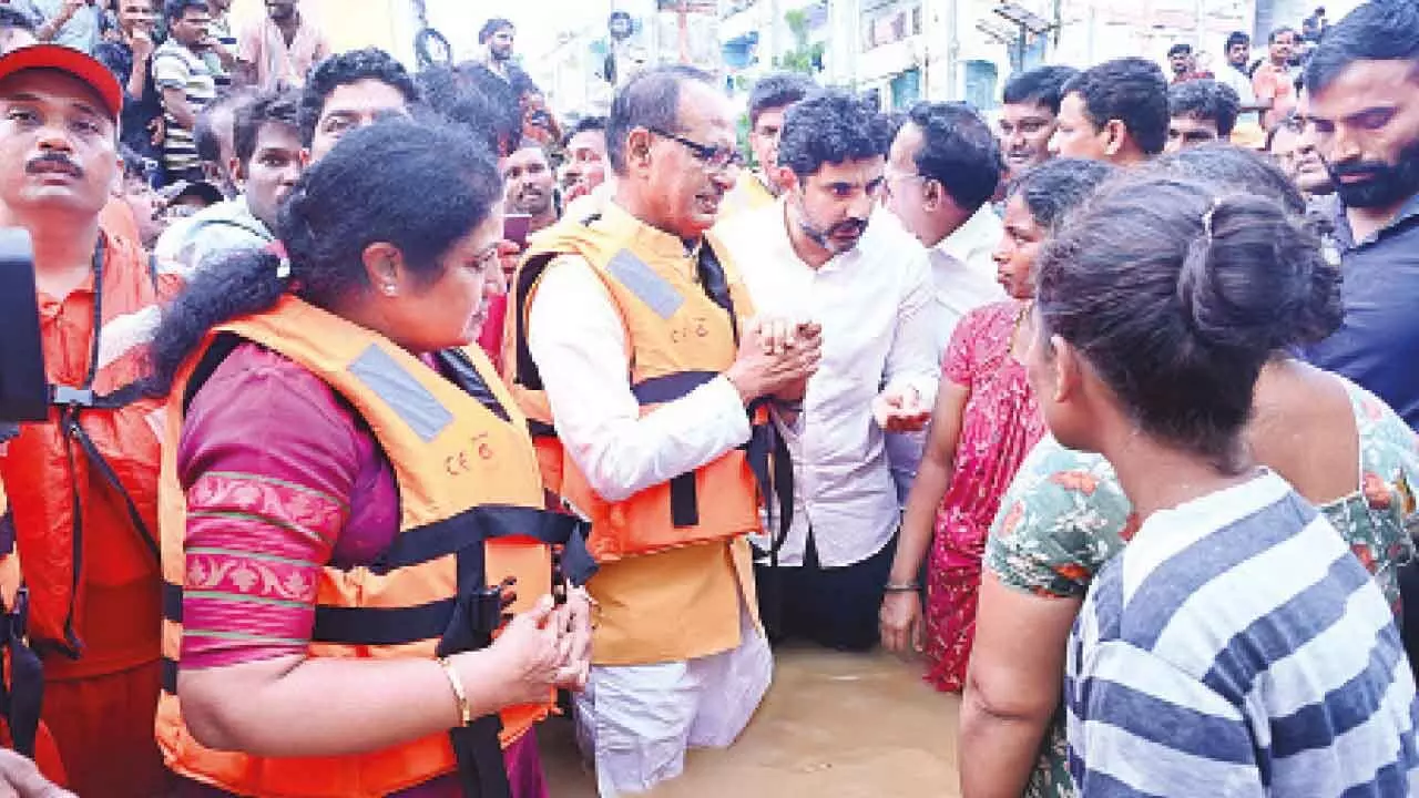 Union Minister of Rural Development Shivraj Singh Chouhan, Andhra Pradesh IT Minister Nara Lokesh and BJP state president D Purandeswari visiting flood-affected areas in Vijayawada on Thursday