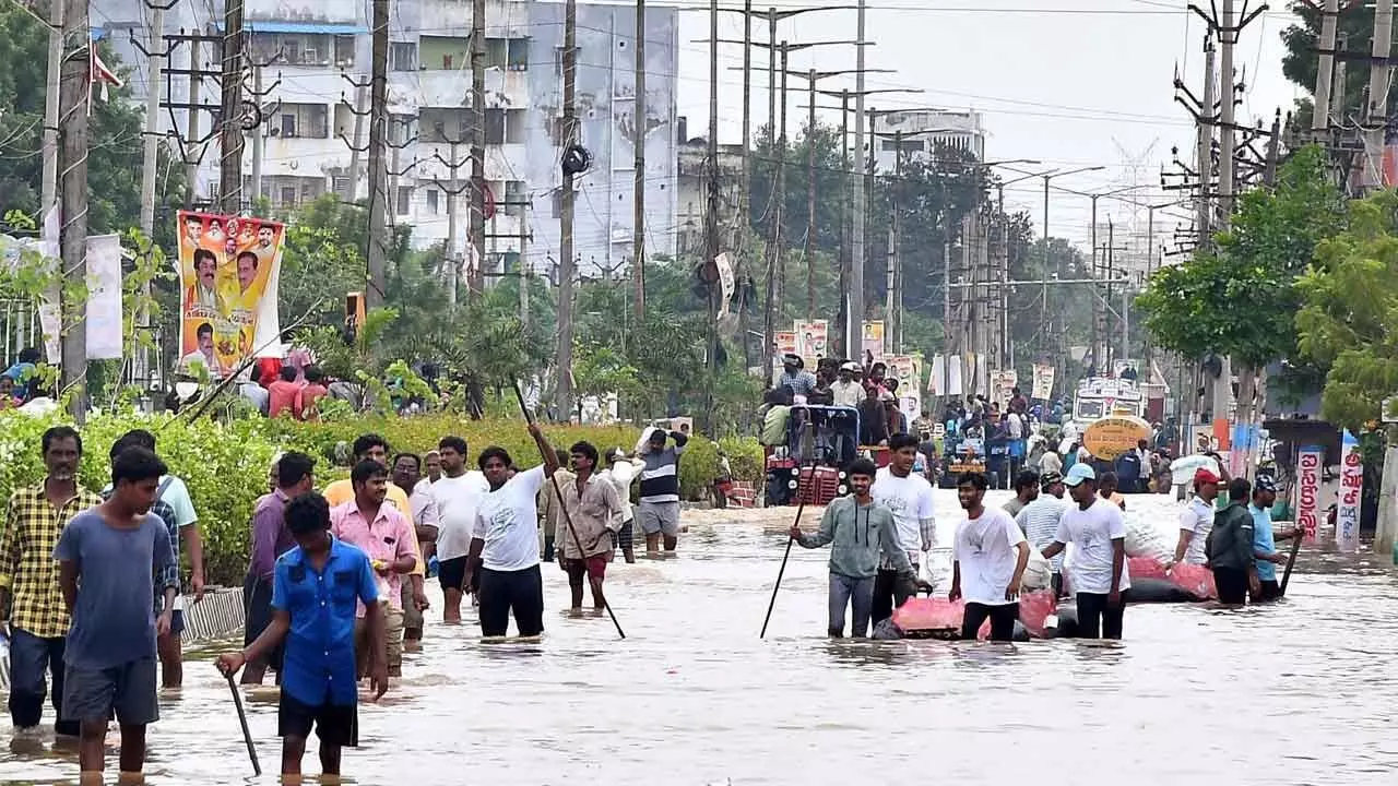 People coming out from flood-affected areas of Singh Nagar in Vijayawada on Thursday    (Photo: Ch Venkata Mastan)