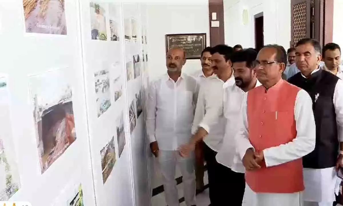 Central Ministers Review Damage from Recent Floods at Photo Exhibition