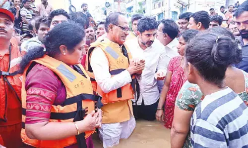 Union Minister of Rural Development Shivraj Singh Chouhan, Andhra Pradesh IT Minister Nara Lokesh and BJP state president D Purandeswari visiting flood-affected areas in Vijayawada on Thursday