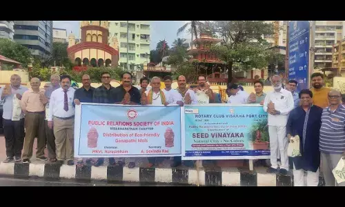 PRSI and Rotary Club Port City distributing clay idols at RK Beach in Visakhapatnam on Thursday.