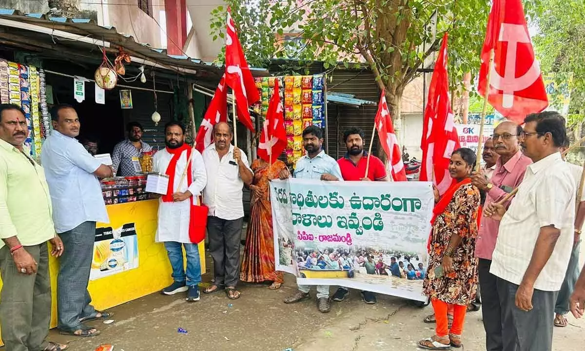 CPI East Godavari district secretary T Madhu and others participating in  fundraising programme to extend support to flood victims