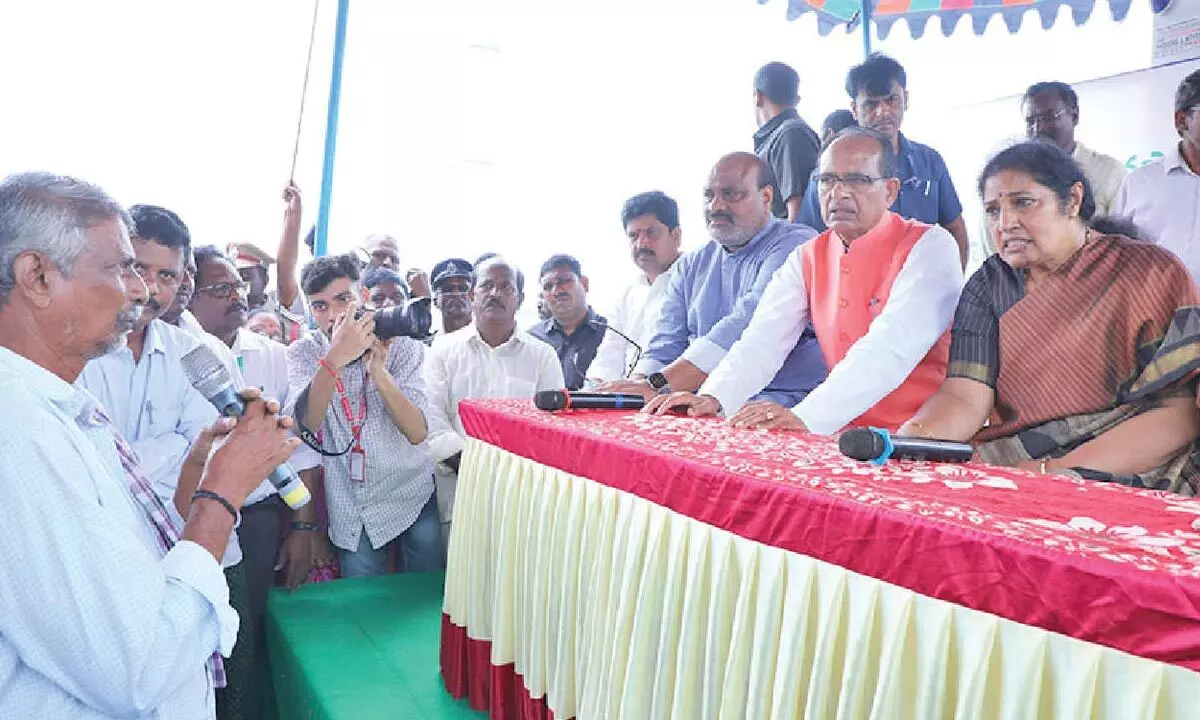 Union agriculture minister Shivraj Singh Chouhan interacts with farmers after inspecting crop  damage at Kesarapalli in Krishna district on Friday. AP agriculture minister K Atchannaidu,  BJP state prsdient D Purandeswari and others are also seen.