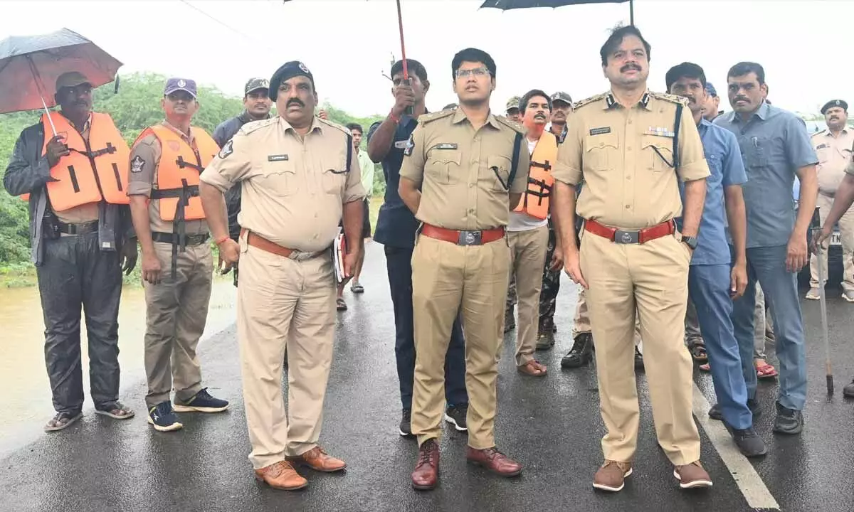 Eluru Range IG GVG Ashok Kumar and SP K Pratap Shiva Kishore visiting flooded areas on Sunday