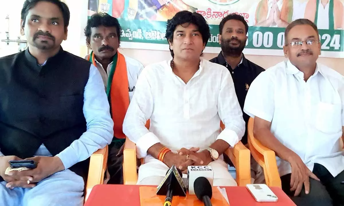 BJP Kakinada district president Chilukuri Ram Kumar, State Spokesperson Peddireddy Ravikiran, and Media Panelist Duvvuri Subrahmanyam speaking at media conference on Sunday