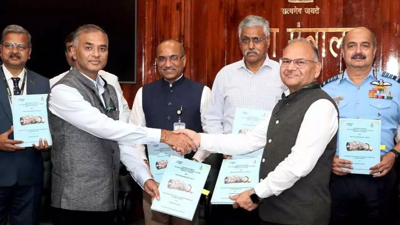 Air Chief Marshal VR Chaudhari (extreme right) and Defence Secretary Giridhar Aramane (third from right) as the sign the contract in New Delhi on Monday