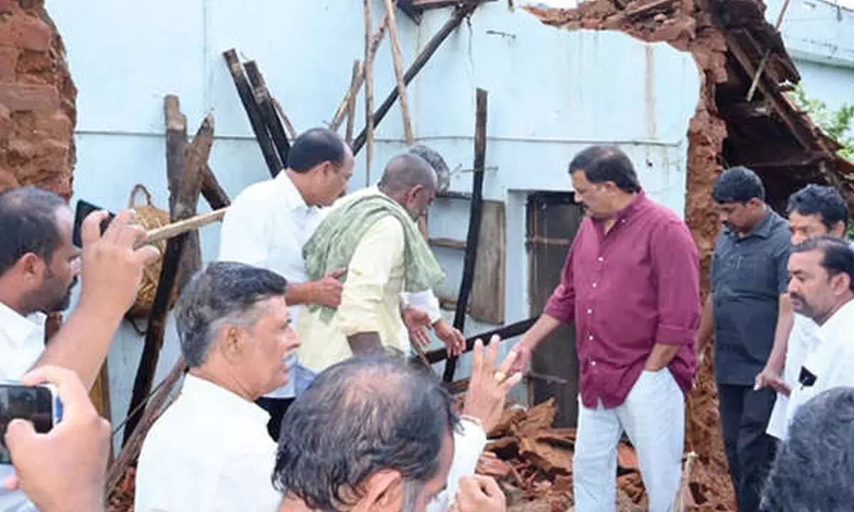 Bheemili MLA helps demolish dilapidated building