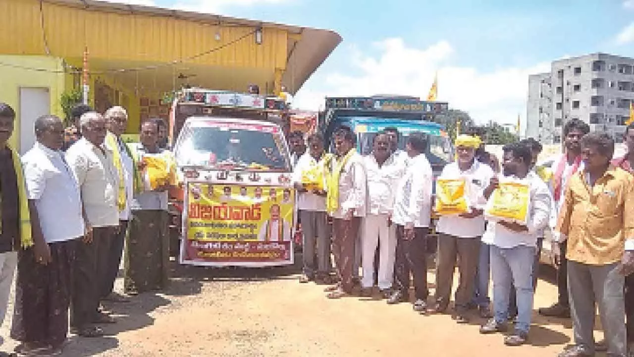 NDA leaders of Sunkollu village dispatching a vehicle with relief material to Vijayawada from Nuzvid on Thursday