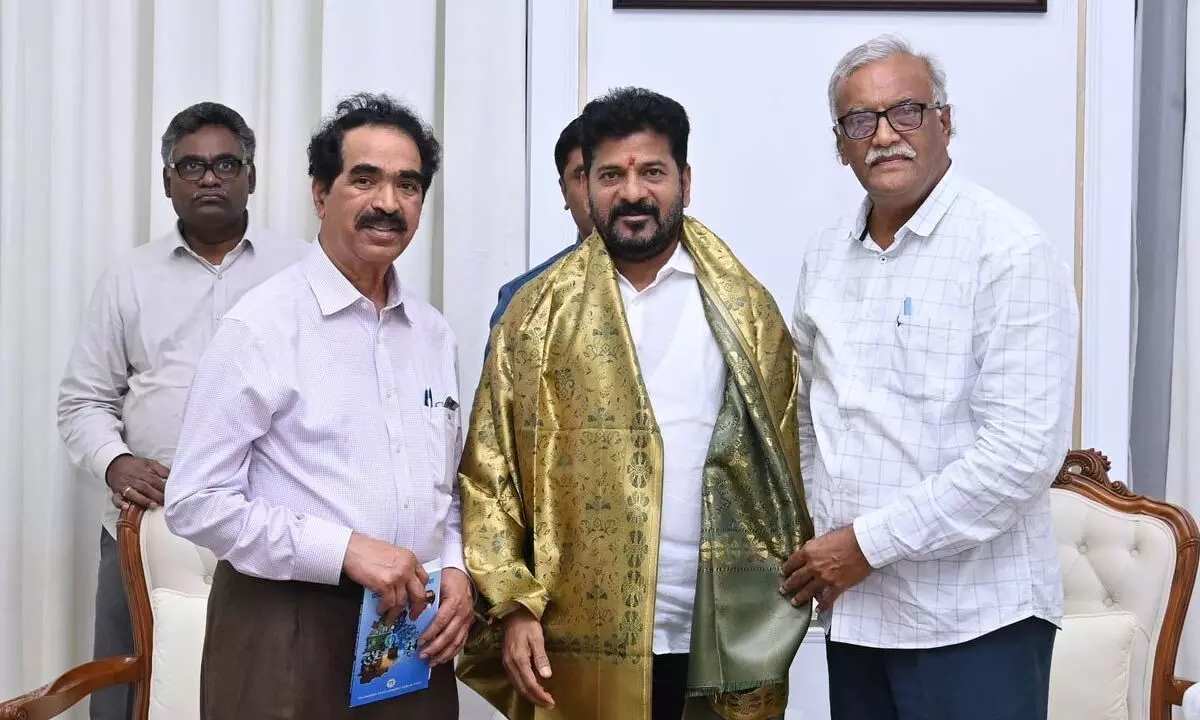 TDF Chairman MVGona Reddy and Gopal Reddy felicitating CM Revanth Reddy during their meeting in Hyderabad