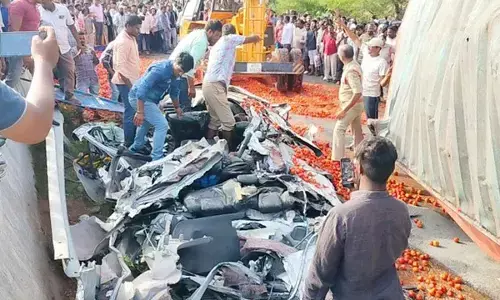 Three die as a loaded truck capsizes on a car