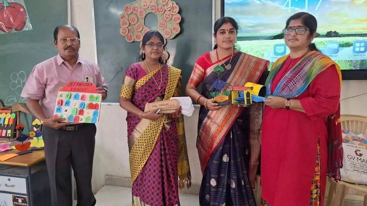 Rajahmundry Urban MEO-2 Rama Rajani honouring teachers for creating teaching and learning materials in the school complex meeting on Tuesday