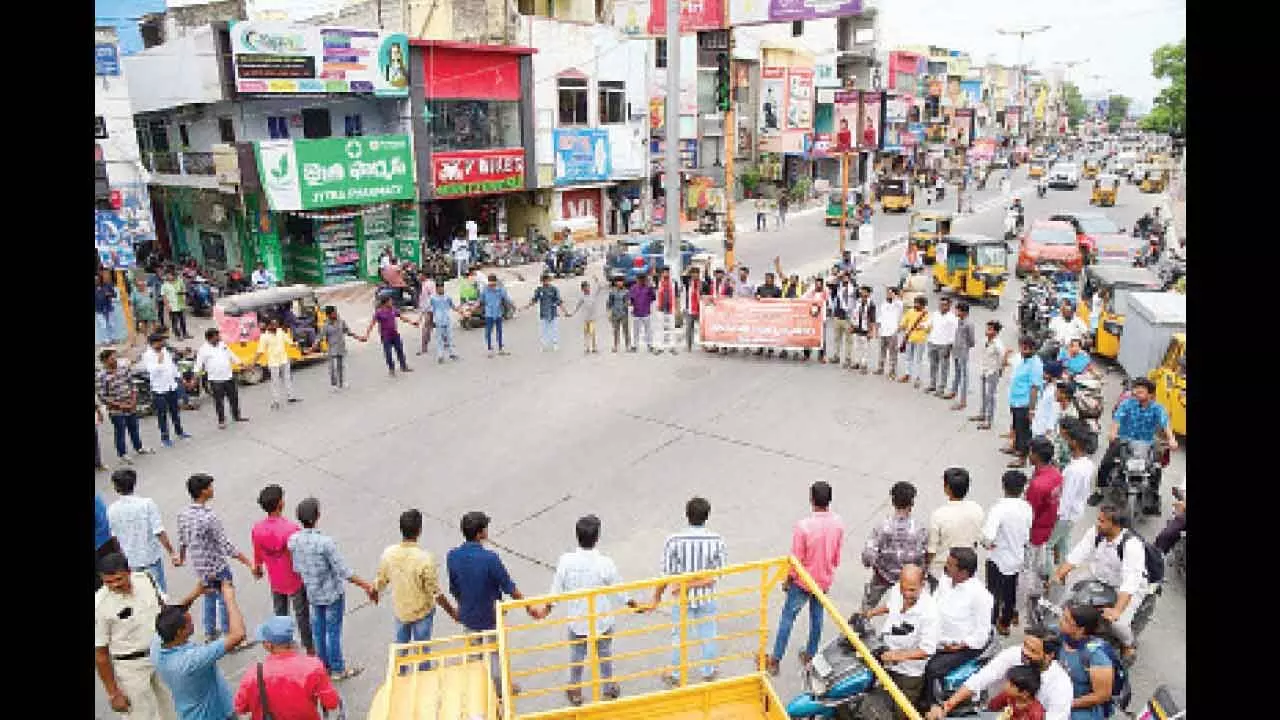 AISF and YSRCP student wings and other unions taking part in a protest in Tirupati on Thursday