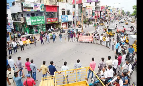 AISF and YSRCP student wings and other unions taking part in a protest in Tirupati on Thursday