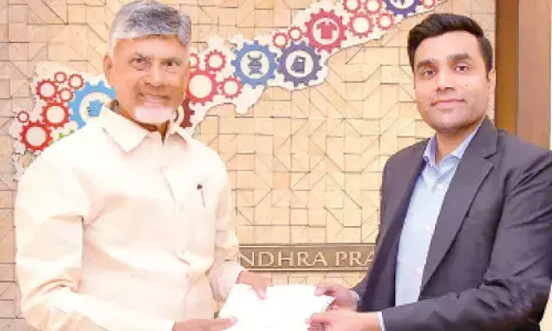 Managing director of Adani Ports and SEZ and son of Gautam Adani hands over cheque for Rs 25 crore to Chief Minister N Chandrababu Naidu towards CM Relief Fund in Amaravati on Thursday