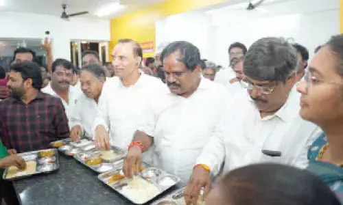 MLA Vamsi Krishna Srinivas Yadav along with others having meals at the newly inaugurated Anna canteen in Visakhapatnam on Thursday