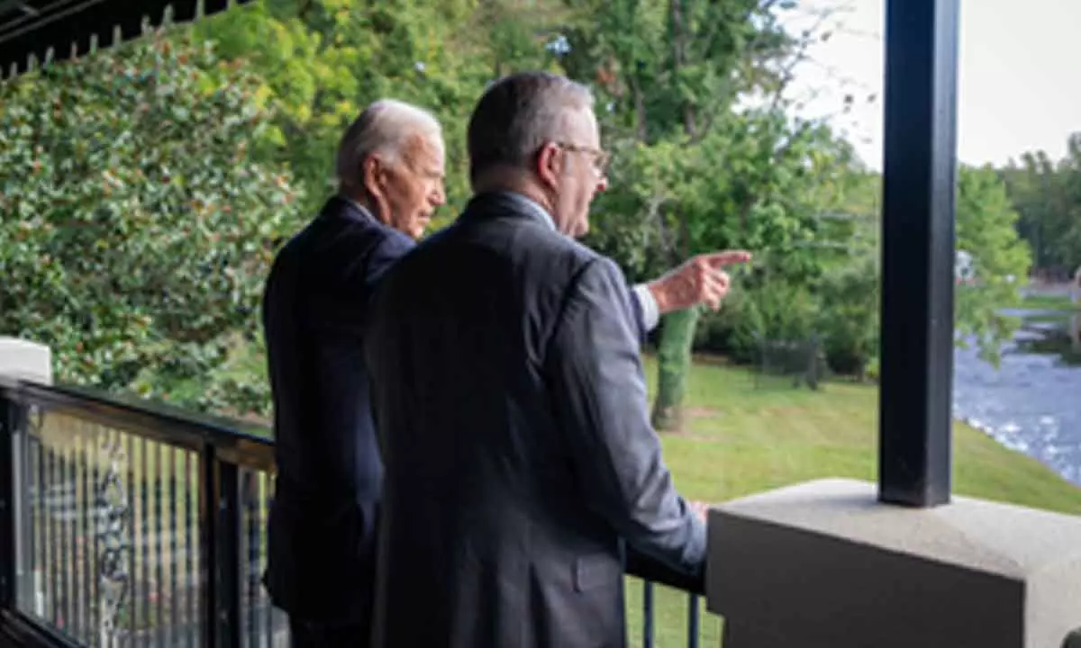 Biden chuffed to receive leather jacket gifted by Australian PM