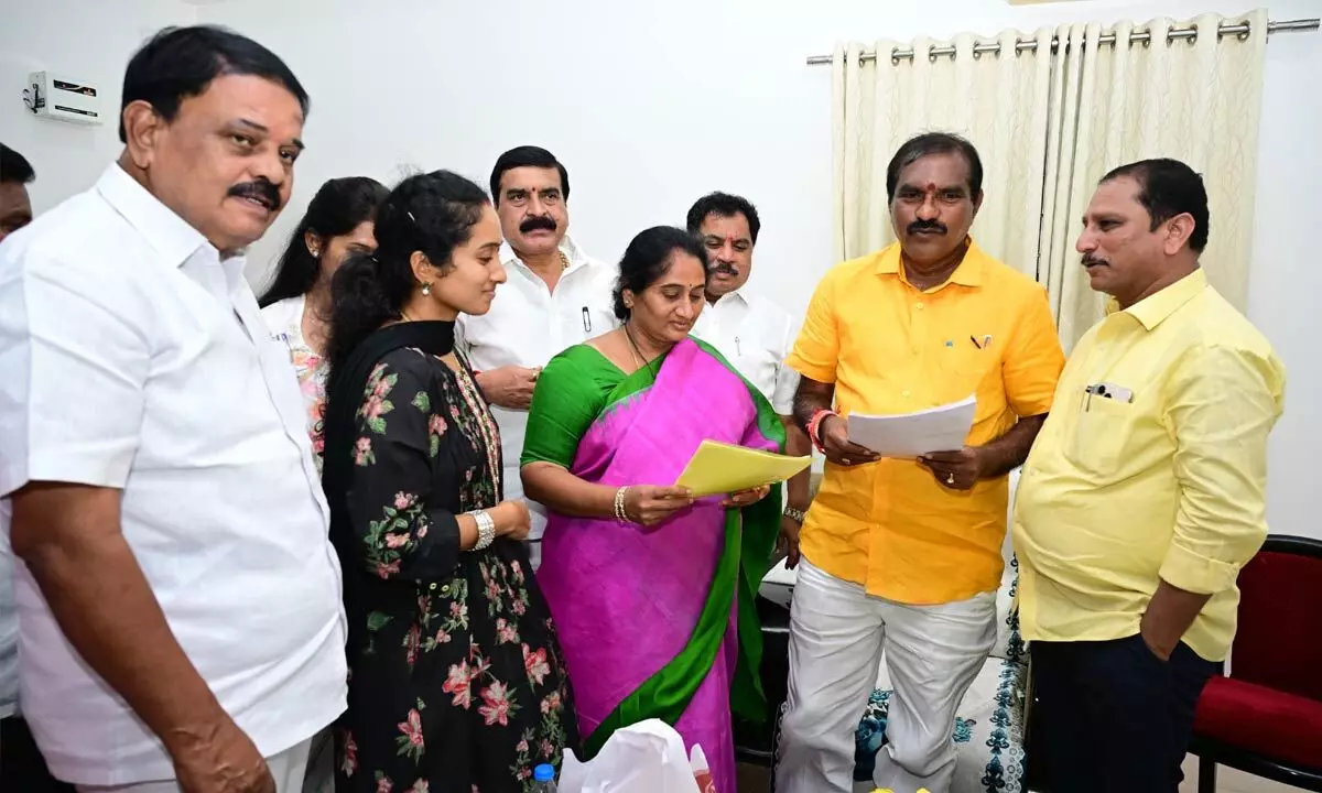 Puttaparthi MLA Palle Sindhura Reddy submitting a representation to Irrigation Minister Nimmala Rama Naidu in Anantapur on Sunday. Former Minister Dr Palle Raghunatha Reddy is also seen.