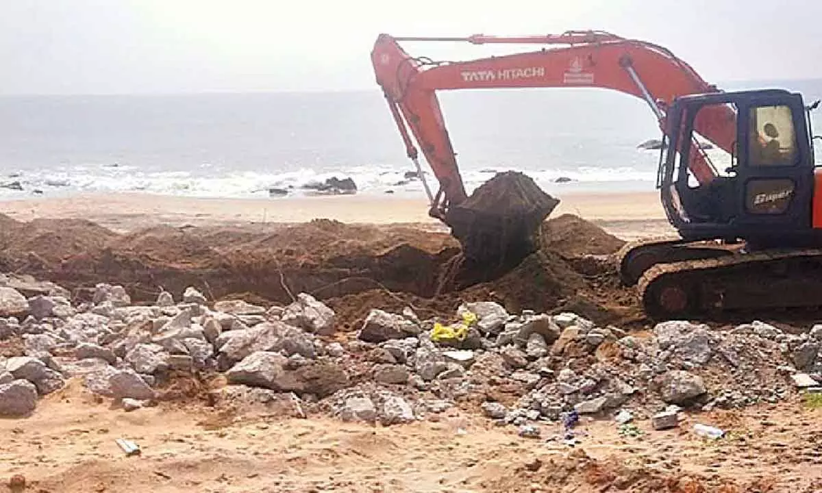 GVMC officials demolishing the illegal construction at Bheemili in Visakhapatnam on Sunday