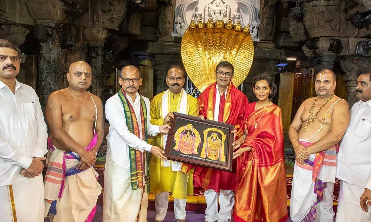 TTD EO J Syamala Rao and Additional EO Ch Venkaiah Chowdhary presenting a portrait of Lord Venkateswara and Goddess Padmavathi to CJI Justice D Y Chandrachud at Tirumala on Sunday