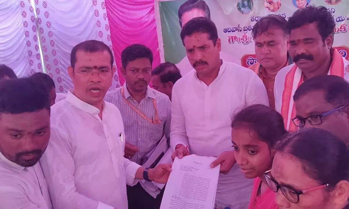 File picture of leader of ASP, V Yogi, along with local tribals registering a complaint with a member of the National Commission for STs during his visit to Srikakulam