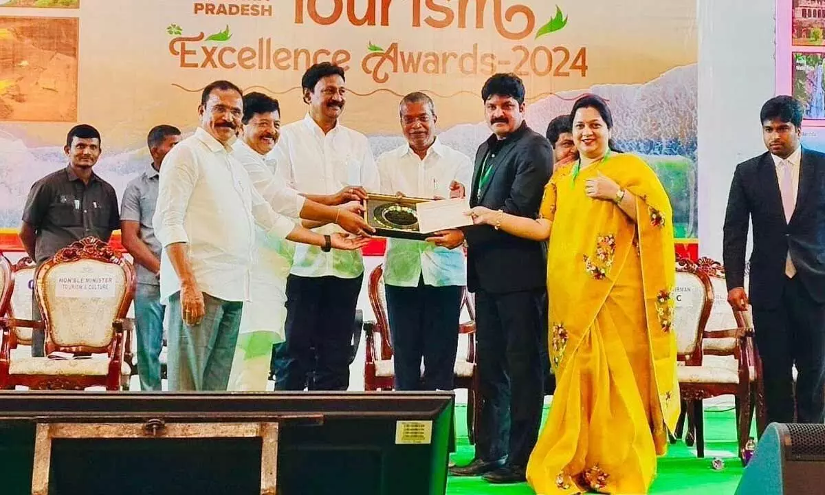 Sun International Institute Tourism and Management CMD Srikanth Jasti and Executive Director  Asha Jasti receiving award from AP Tourism Minister Kandula Durgesh