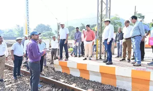 Railway officials inspecting the commissioning of the Gorapur- Darliput section doubling
