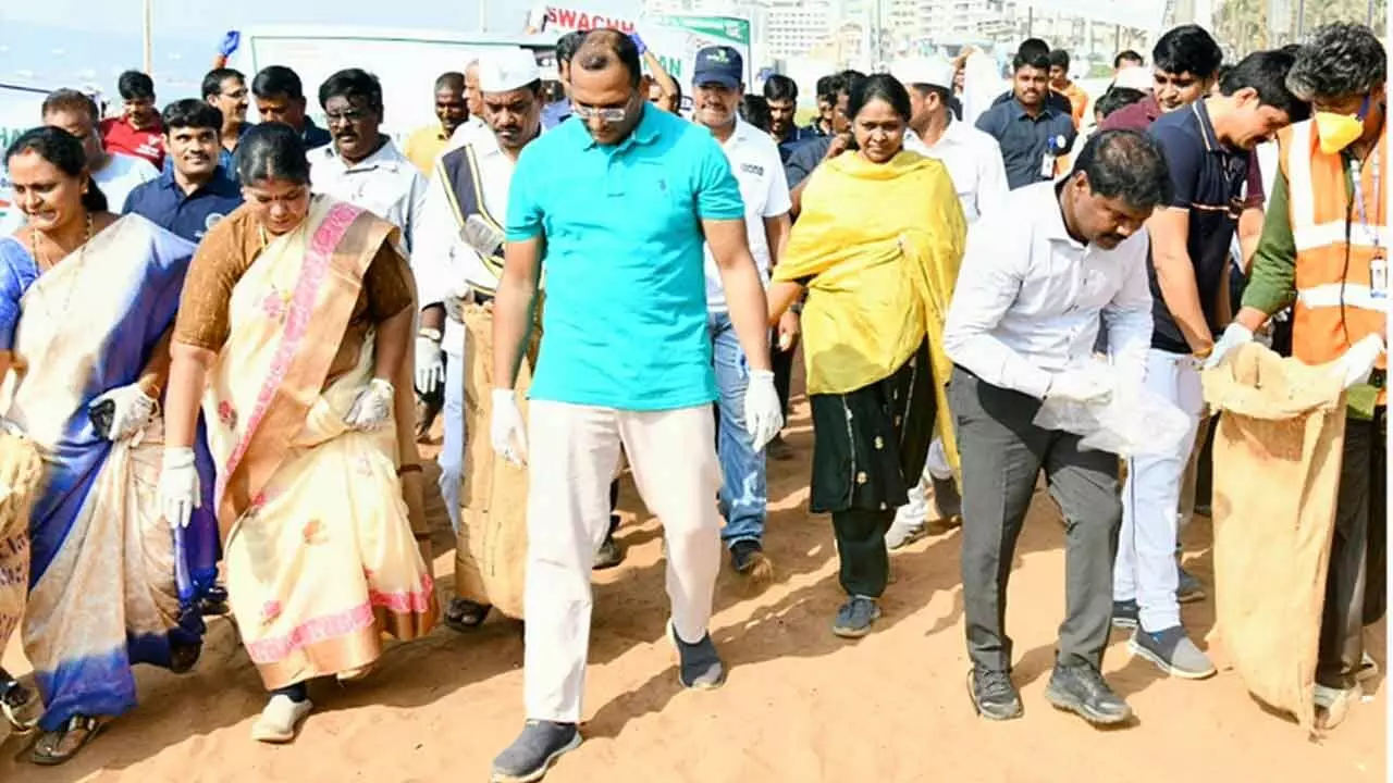 Visakhapatnam District Collector MN Harendhira Prasad, GVMC Mayor G Hari Venkata Kumari and Commissioner P Sampath Kumar participating in a cleanliness drive held at RK beach in Visakhapatnam