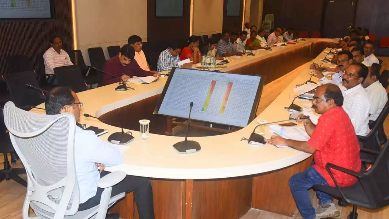 District collector MN Harendhira Prasad discussing with the officials in a review meeting held in Visakhapatnam on Thursday