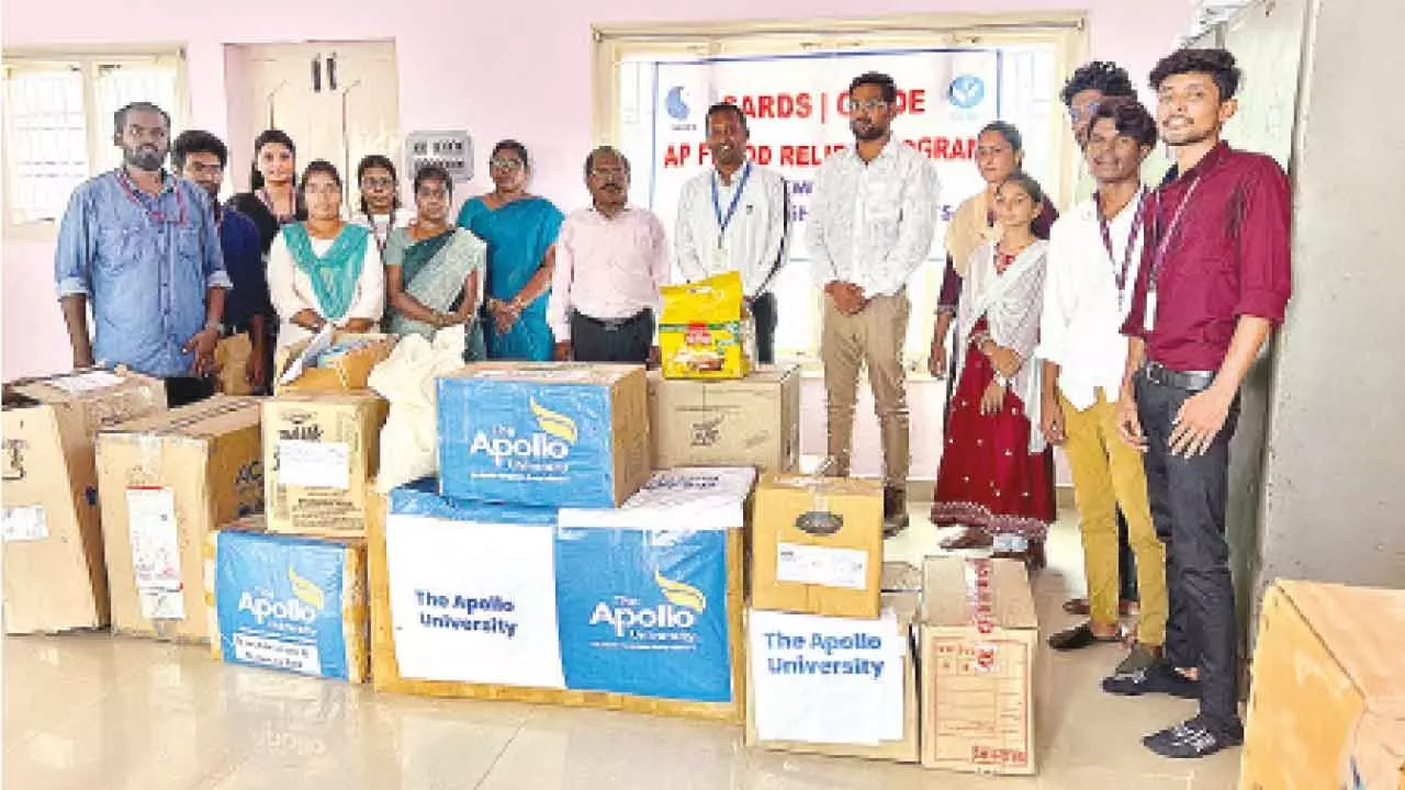 The students of Master of Public Health of Apollo University distributing essentials to the flood victims at Yanamalakduru near Vijayawada on Thursday