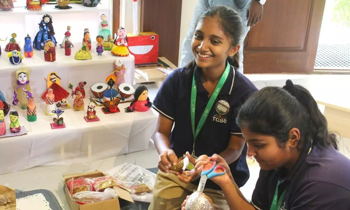 Students create traditional dolls from waste