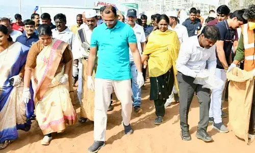 Visakhapatnam District Collector MN Harendhira Prasad, GVMC Mayor G Hari Venkata Kumari and Commissioner P Sampath Kumar participating in a cleanliness drive held at RK beach in Visakhapatnam