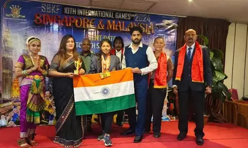 Institution deans and HoDs congratulating K Sahithi in Visakhapatnam on Thursday