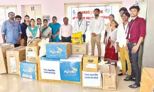 The students of Master of Public Health of Apollo University distributing essentials to the flood victims at Yanamalakduru near Vijayawada on Thursday