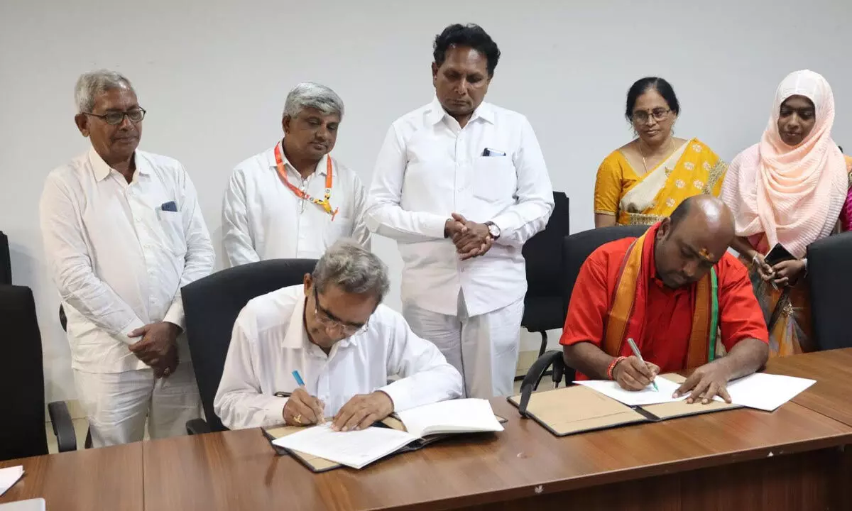 APSSDC executive director K Dinesh Kumar and managing trustee of Sri Sathya Sai Seva Trust G Sai Viswanadham signing MoU at APSSDC office in Tadepalli on Friday