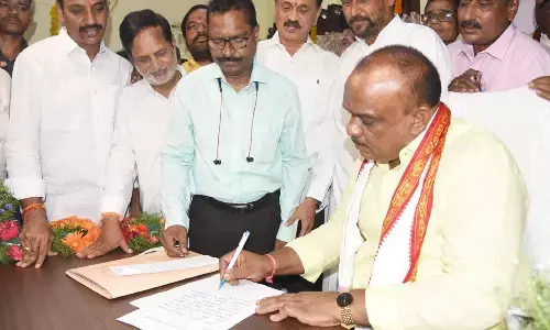 Peela Govinda Satyanarayana taking charge as the chairman of APUFIDC in Vijayawada on Friday