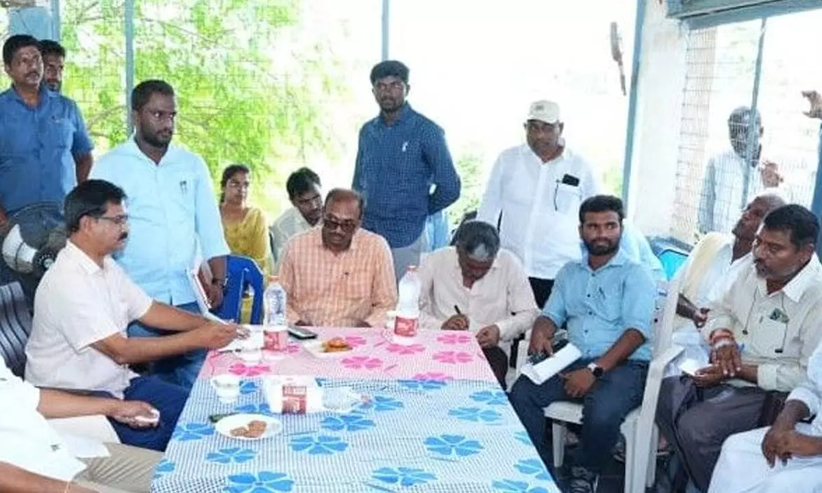 Minister Gottipati Ravi Kumar interacting with officials and locals after inspecting Addanki Branch Canal on Sunday