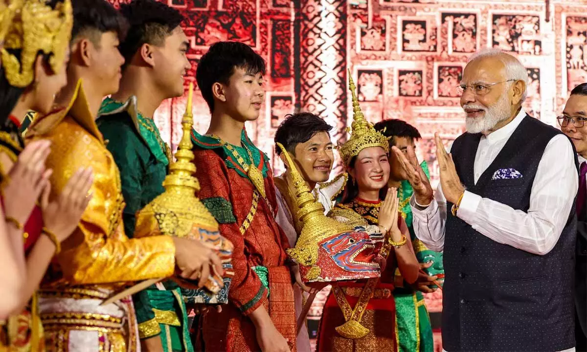 Prime Minister Narendra Modi meets performers of Ramayana at a ceremony, in Vientiane, Laos on Thursday