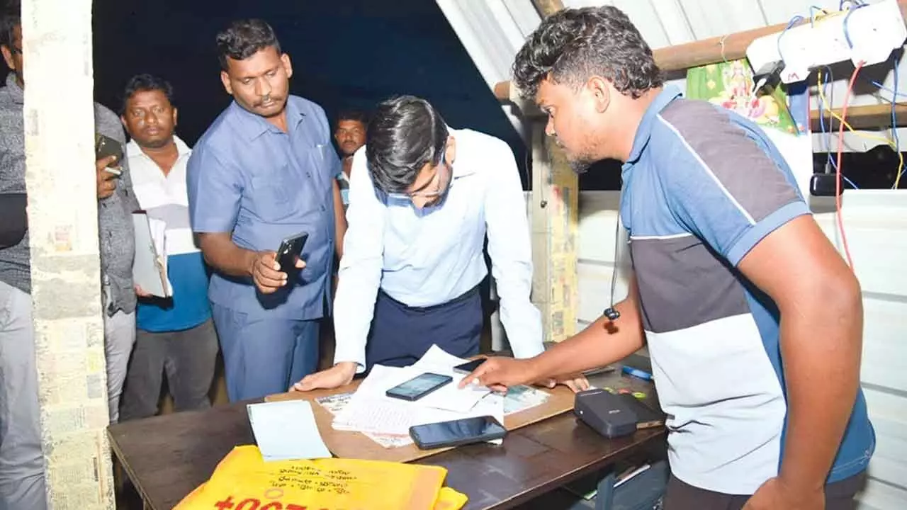 Collector O Anand inspects sand reach