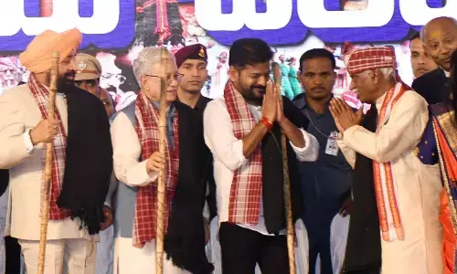 Haryana Governor Bandaru Dattatreya, who conceptualised the Alai Balai programme, welcomes Chief Minister A Revanth Reddy to the programme at the Exhibition Grounds in Hyderabad on Sunday. Photo: G Ramesh
