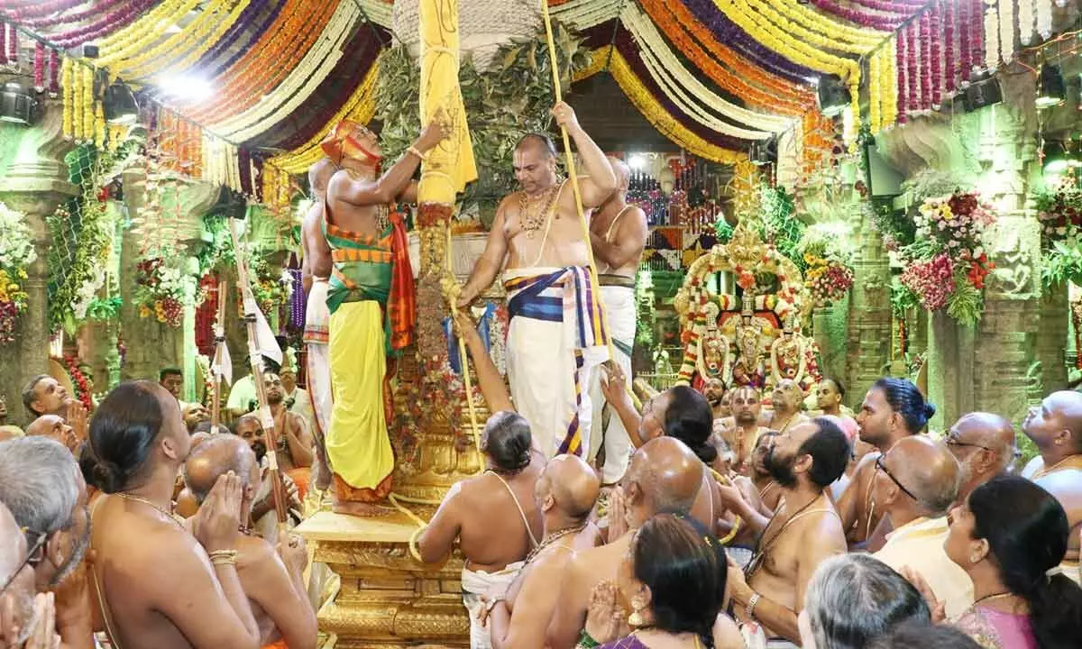 Priests performing Dhwajaavarohanam to mark the conclusion of the nine-day Brahmotsavam at Tirumala on Saturday evening