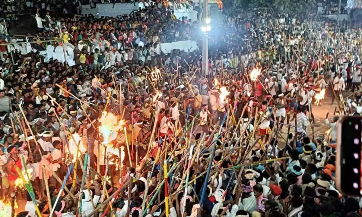 People stage a ritualistic mock stick fight as part Banni festival in Holagunda mandal on Saturday night