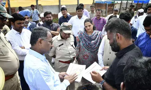 S Suresh Kumar, Secretary of Investments and Infrastructure and Dr G Srijana, NTR district collector, DCP Gautami Sali and others reviewing the arrangements on the banks of River Krishna on Tuesday for the Amaravati Drone Show to be held on October 22