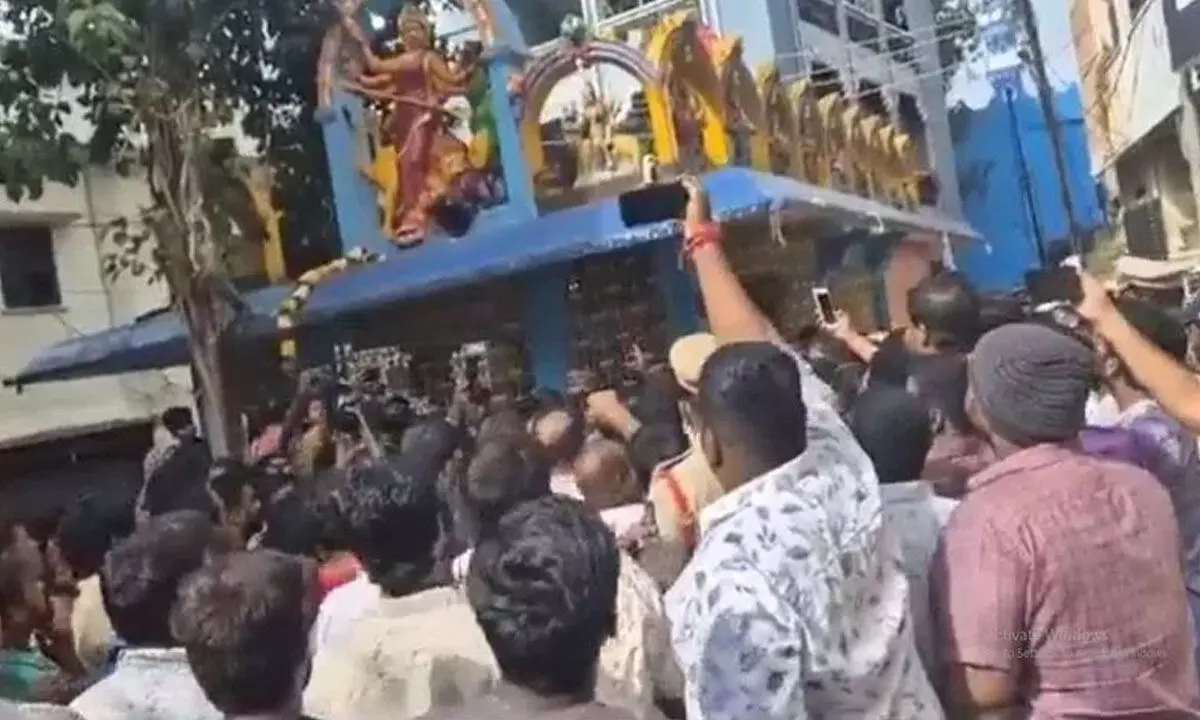 Tension erupts again at city temple, officials seize hotel